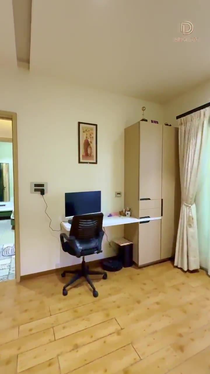 Study corner with a built-in desk and wardrobe in a handed-over D Realty apartment.